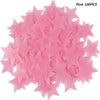 A pile of pink glow-in-the-dark 3D star wall stickers for kids' rooms and bedrooms.