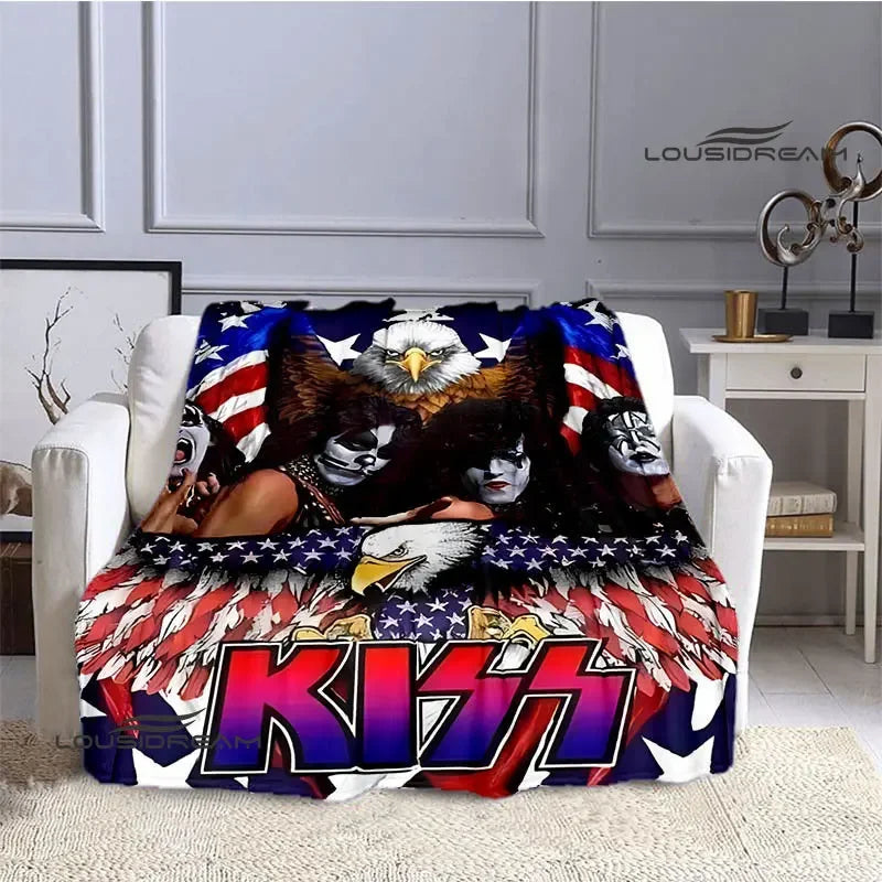 A flannel throw blanket featuring a graphic design of the KISS band logo and eagle imagery.