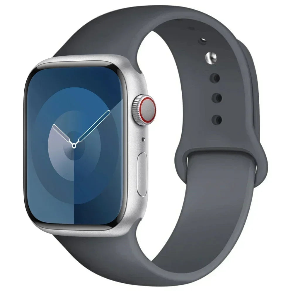 A silver Apple Watch encased in a gray silicone sport band.