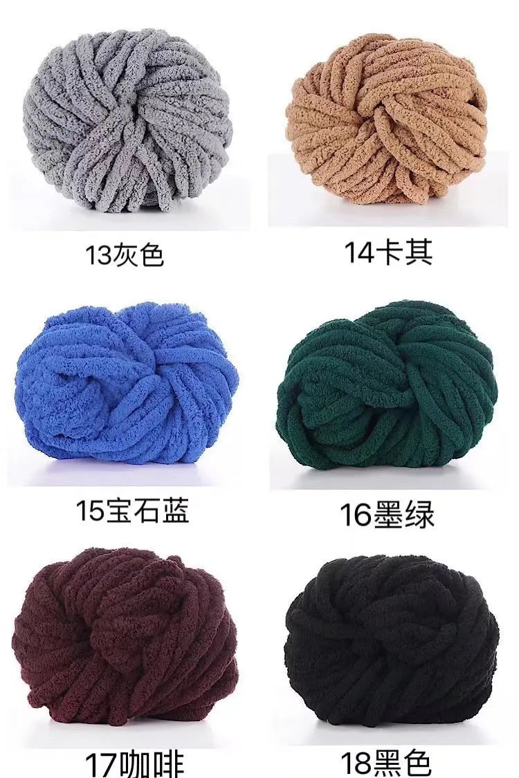 A collection of chunky acrylic yarn skeins in various colors and textures, including gray, beige, blue, green, maroon, and bl