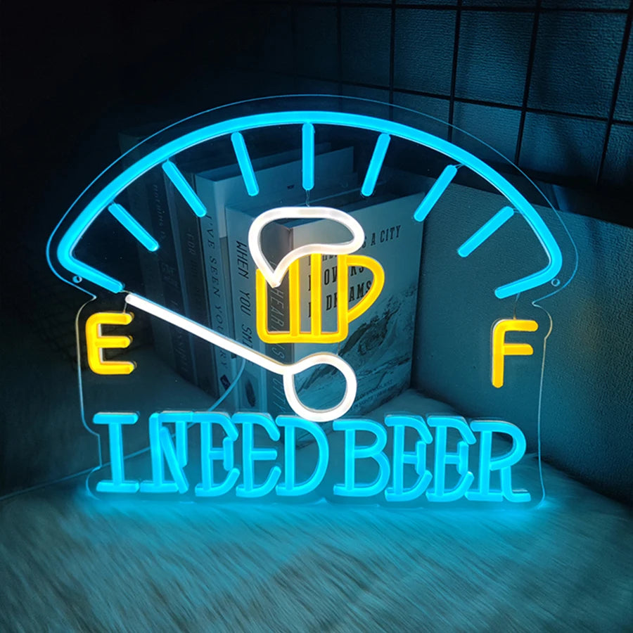 Neon sign shaped like a beer glass with the text NEED BEER glowing bright blue on a dark background