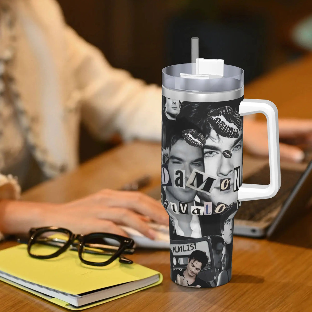 A silver insulated stainless steel tumbler with a black and white graphic featuring a close-up of a man's face.
