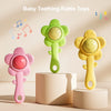 Three baby teething rattle toys in pink, green, and yellow featuring a flower design for sensory play