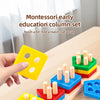A hand holds a yellow geometric stacking block from a Montessori early education column set on a wooden surface.