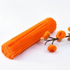 A bundle of 100 orange pipe cleaners with small, fluffy orange pom-poms attached.