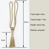 A set of two beige polyester tassel curtain tiebacks with a total length of 45cm.