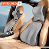 A memory foam car headrest and lumbar support cushion installed in a vehicle seat.