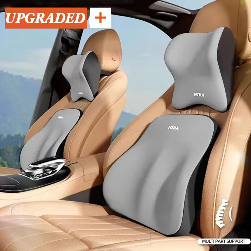 A memory foam car headrest and lumbar support cushion installed in a vehicle seat.