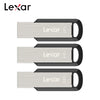 Three Lexar flash drives of different capacities 32GB, 64GB, and 128GB shown side by side.
