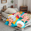 Pop art print blanket featuring four smiling older women in vibrant colors