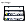 A pair of black racing style license plate frames with the Greddy logo.