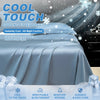 A close-up of a blue cooling fitted sheet on a bed, emphasizing its cool touch and features.