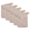 A stack of five beige cotton muslin baby burp cloths.