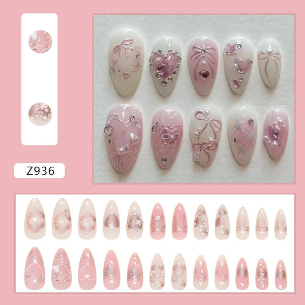 Colección de uñas postizas con brillo en tonos rosa y morado.