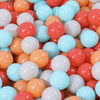 A close-up view of a large pack of colorful plastic ball pit balls in shades of orange, pink, white, and light blue.