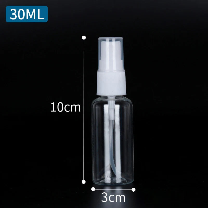 A clear glass spray bottle with a white pump dispenser and a white cap, shown against a black background.