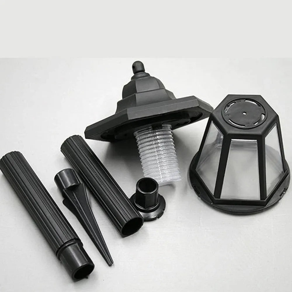 A black solar-powered LED wall light for garden and patio, shown with various components.