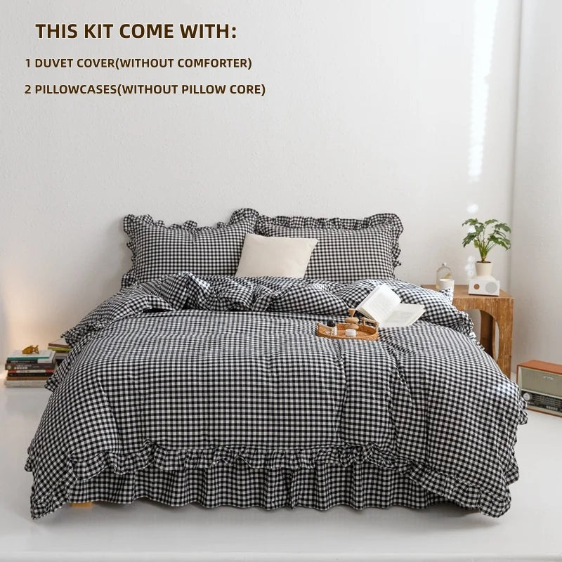 A plaid duvet cover set with two pillowcases displayed on a bed.