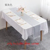 Elegant silver satin table runner set with plates and cutlery for a formal event