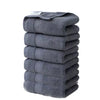 A stack of six gray premium pure cotton face towels.