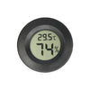 A round, black digital thermometer displaying 29.5°C and 74% humidity.