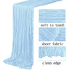 Light blue semi-sheer gauze table runner with a clean edge and soft to touch texture.