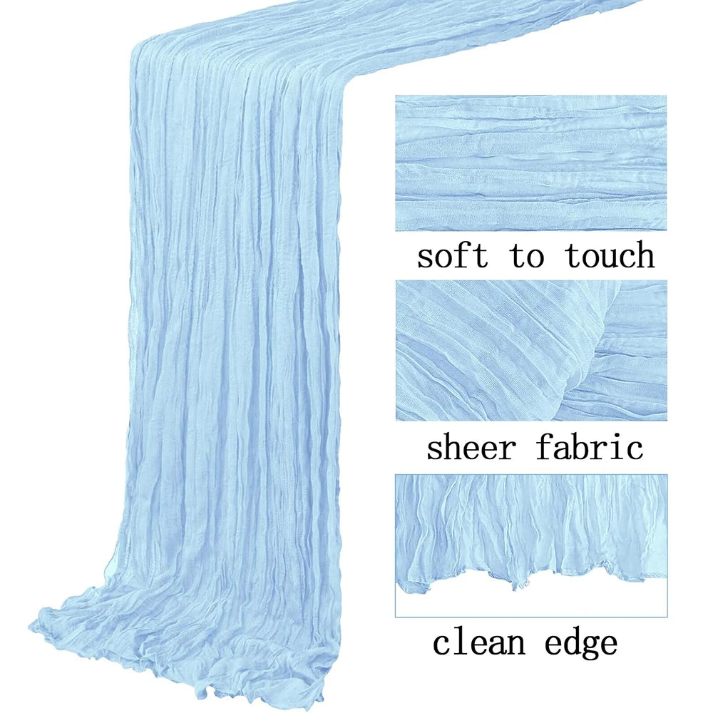 Light blue semi-sheer gauze table runner with a clean edge and soft to touch texture.