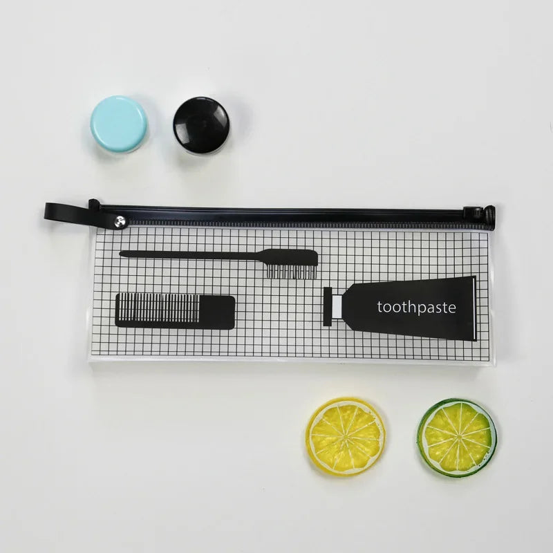 A transparent travel toiletry bag with a hanging hook, featuring black and light blue components and a toothbrush.