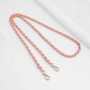 Pink and gold chain strap with a metal buckle for a crossbody bag