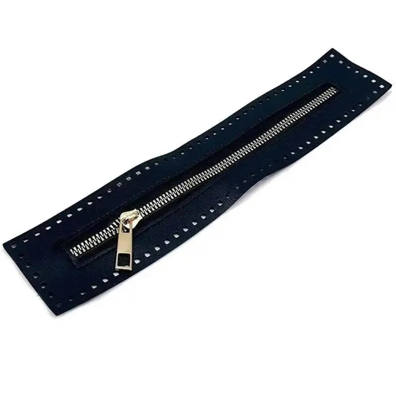 A dark blue leather zipper with a brass pull, suitable for handbags and sewing projects.