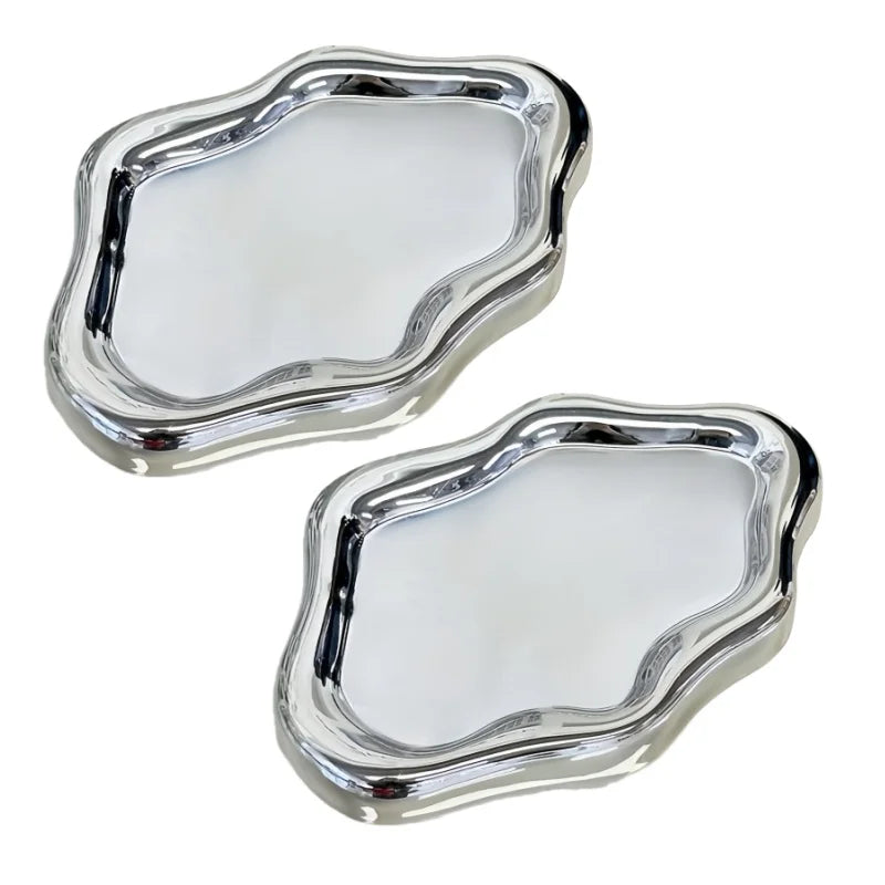 A silver cloud-shaped jewelry tray with a slightly irregular, rounded outline.