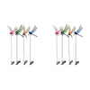 A set of lifelike dragonfly garden clips with insect repellent designs in various colors like pink, green, and blue.