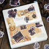 A page from a journal featuring vintage-style paper elements and metal-embossed decorative stickers for crafting