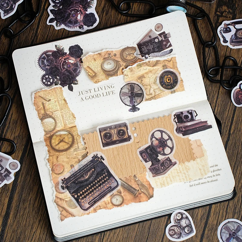 A page from a journal featuring vintage-style paper elements and metal-embossed decorative stickers for crafting