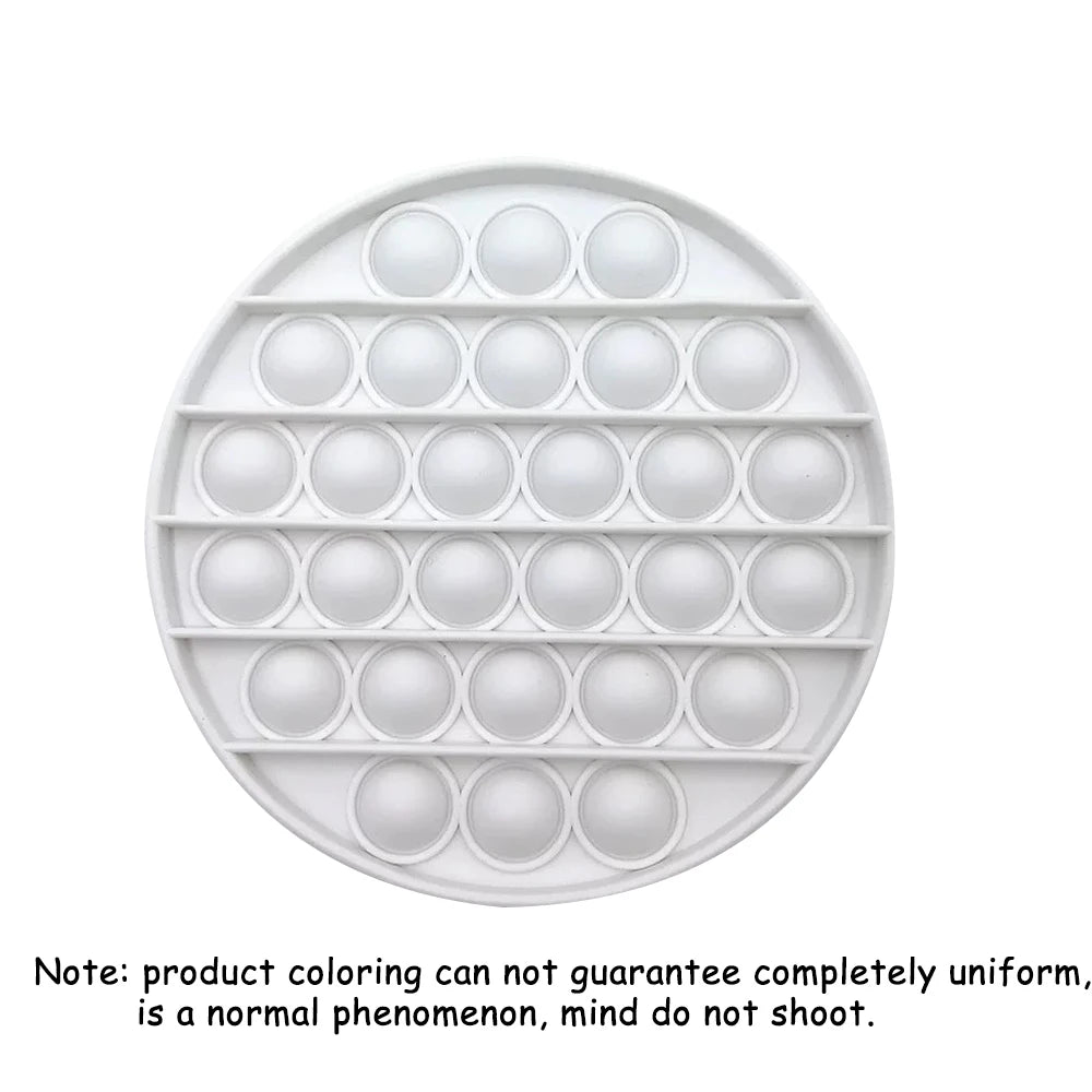 A white silicone Pop-It fidget board with multiple circular holes for sensory stress relief.