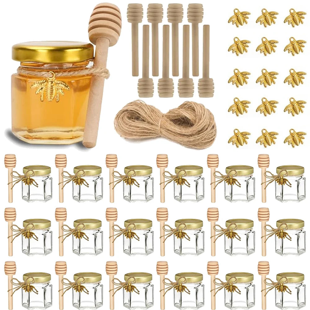 Set of hexagon mini glass honey jars with wood dippers and gold lids