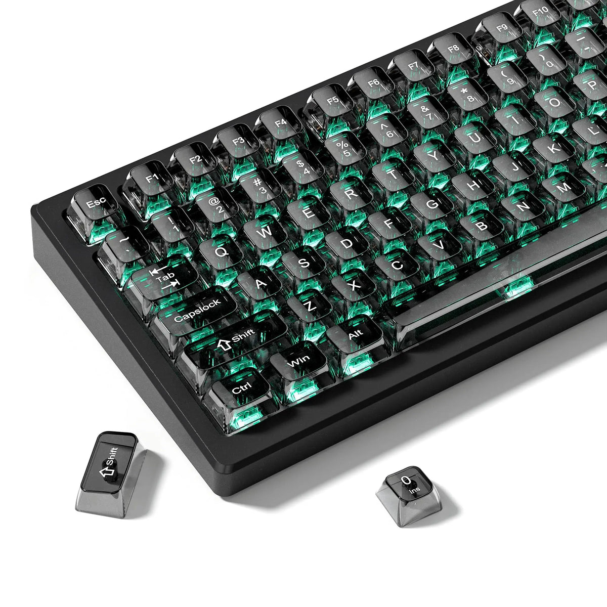 A close-up view of a black mechanical keyboard featuring crystal clear RGB backlit keycaps and MDA profile.