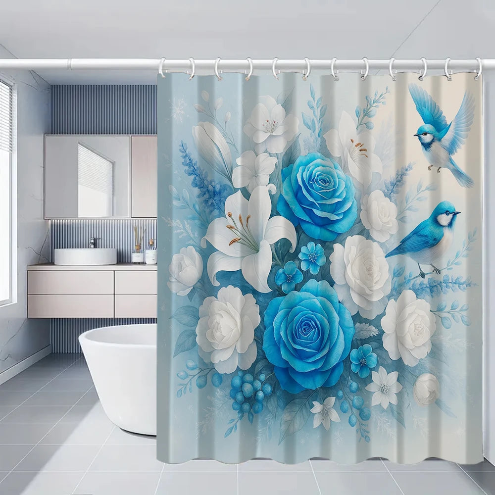 A light blue floral shower curtain featuring white and blue roses, leaves, and a small blue bird.