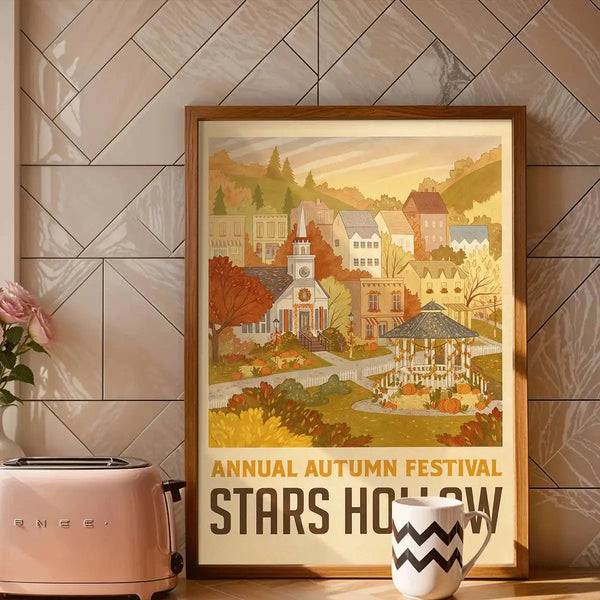 A framed canvas art print depicting a village scene for an annual autumn festival with warm colors and foliage.