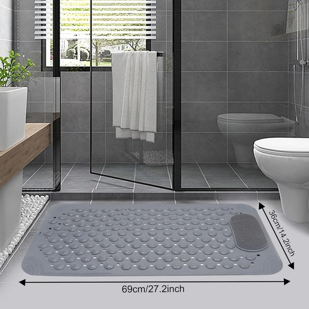 Gray non-slip suction cup bath mat with massage nodes placed on a tiled bathroom floor.