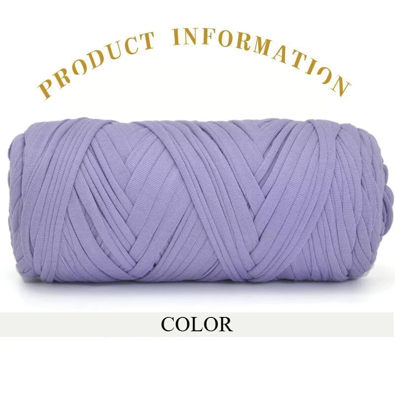 Purple thick polyester blend yarn skein rolled into a cylinder for knitting and crochet