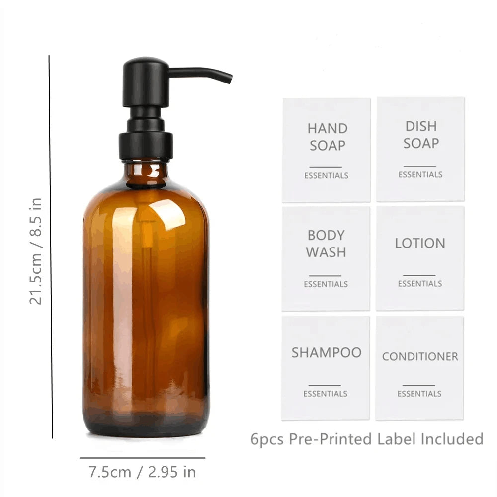 Amber glass soap dispenser bottle with a black pump and six pre-printed labels for hand soap, dish soap, body wash, lotion, s