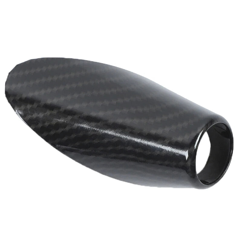 Black carbon fiber antenna base cover for a Dodge RAM 1500 vehicle.