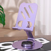 Sujetador giratorio de teléfono morado de 360° para escritorio con base magnética y soporte ranurado.