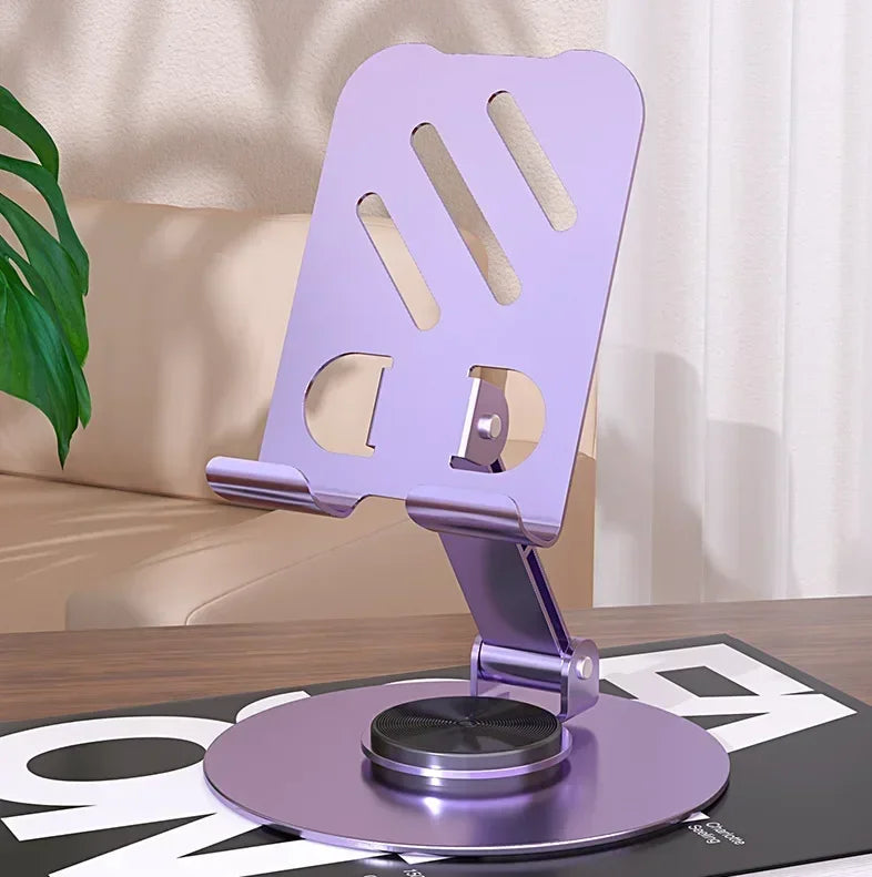 Sujetador giratorio de teléfono morado de 360° para escritorio con base magnética y soporte ranurado.
