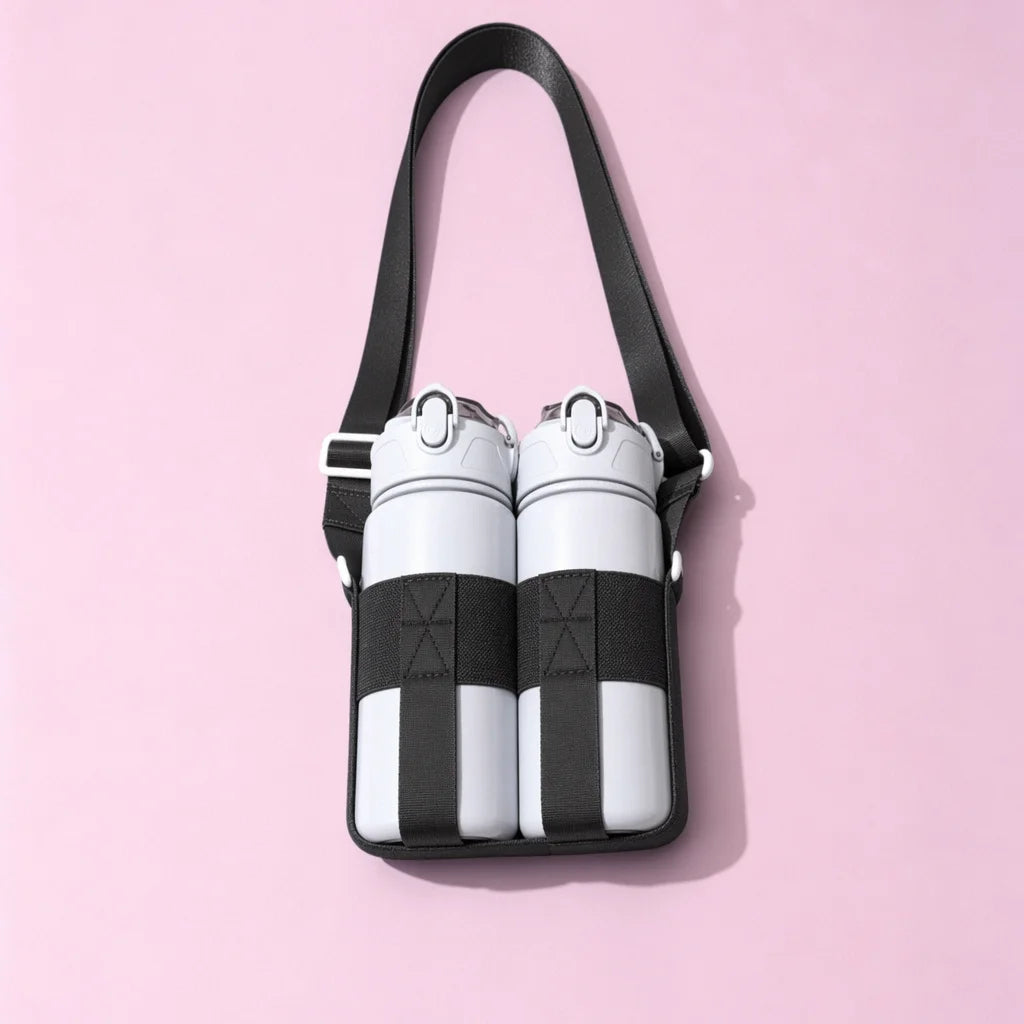 A black breathable mesh crossbody water bottle carrier with two white and black striped bottles.