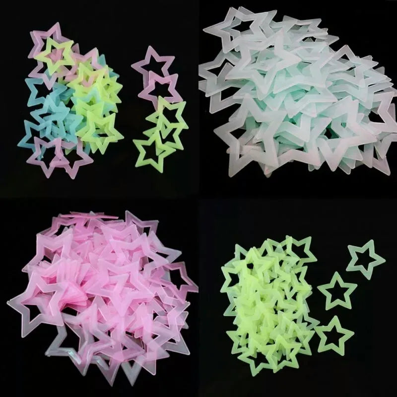 A collection of glow-in-the-dark 3D star wall stickers in pink, blue, and green shades.