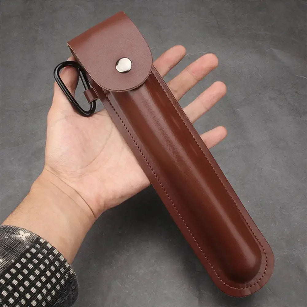 A brown leather holster for a manual wood auger drill is held in a hand against a dark gray background.