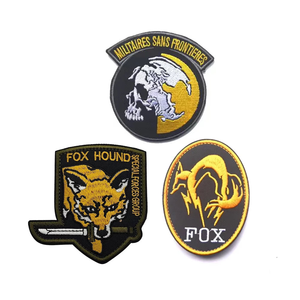 Embroidered patch featuring a stylized fox head and lightning bolt design on a black background with gold embroidery.