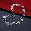 Pulsera de Cadena Corazón y Flor en Plata de Ley